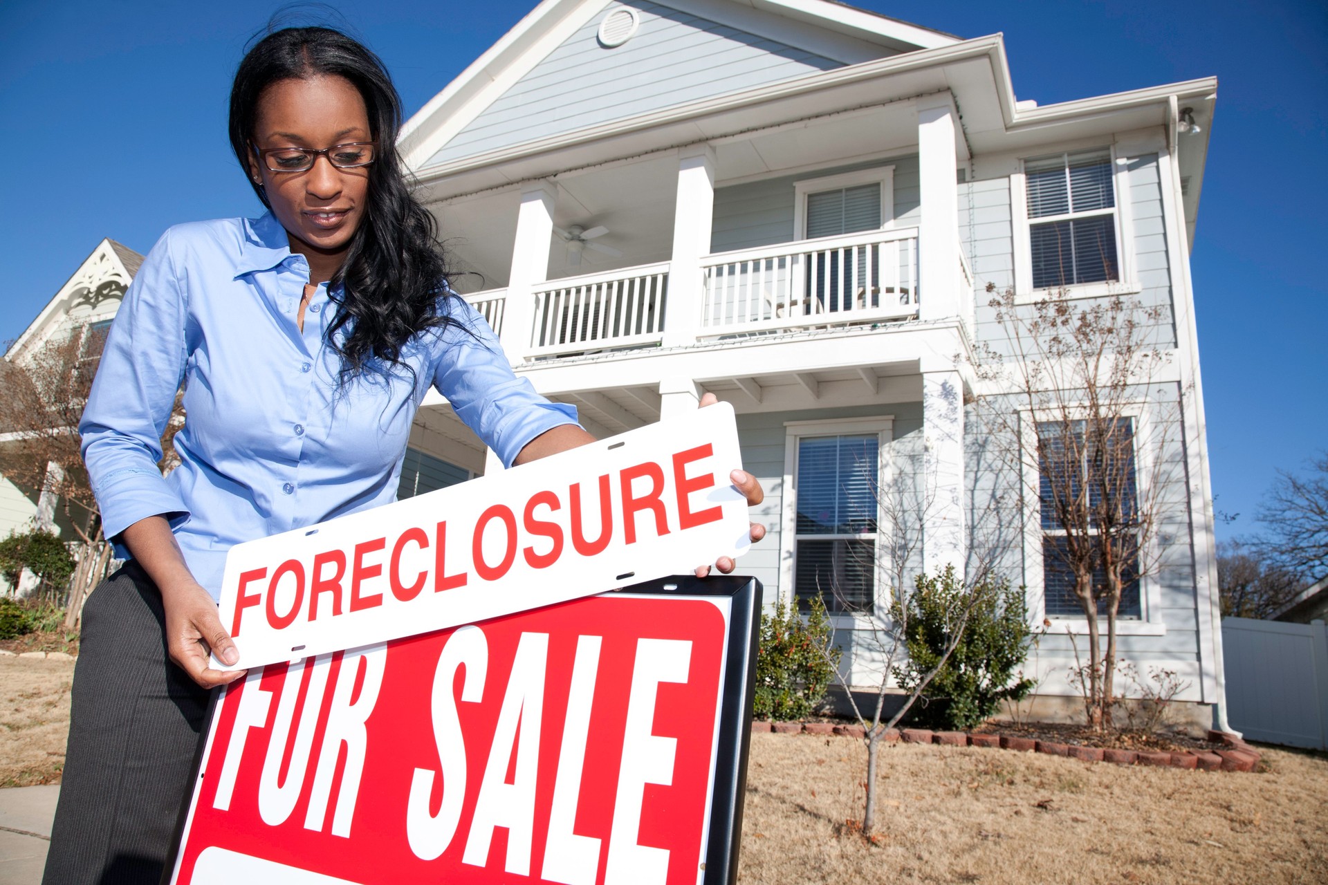 Woman Putting House Up for Foreclosure Sale