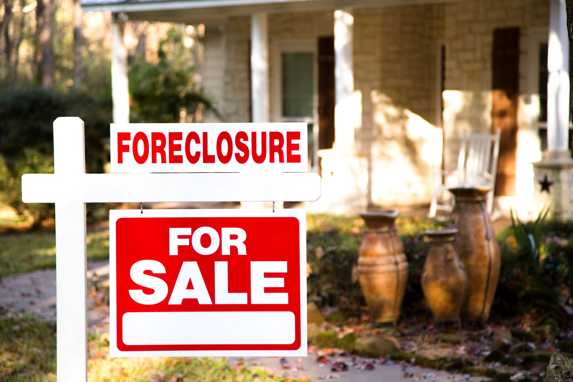Home for sale with real estate sign.  Front yard.